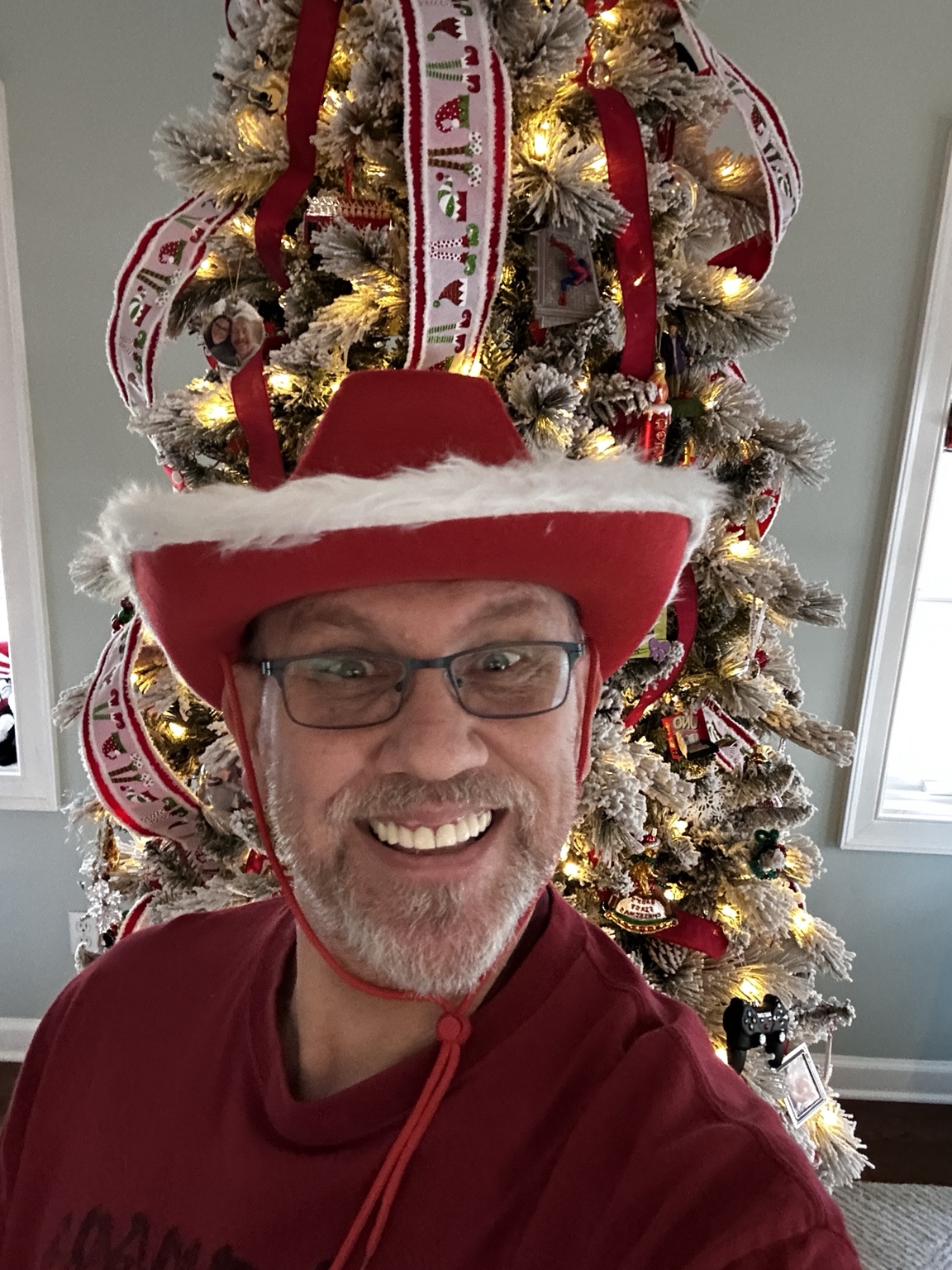 Chuck Dumas in a festive holiday sweater, reflecting the approachable, authentic, and community-focused personality behind V3 Rhyno Life.
