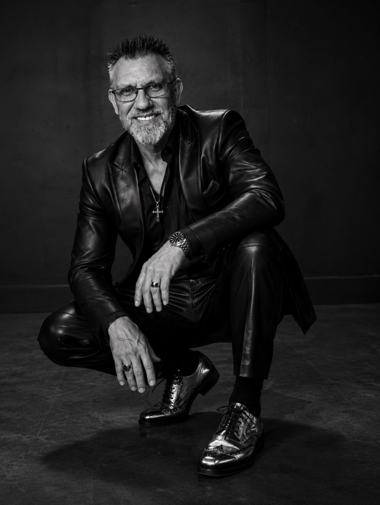 A black and white portrait of Chuck Dumas representing legacy, character, and lifelong purpose.
