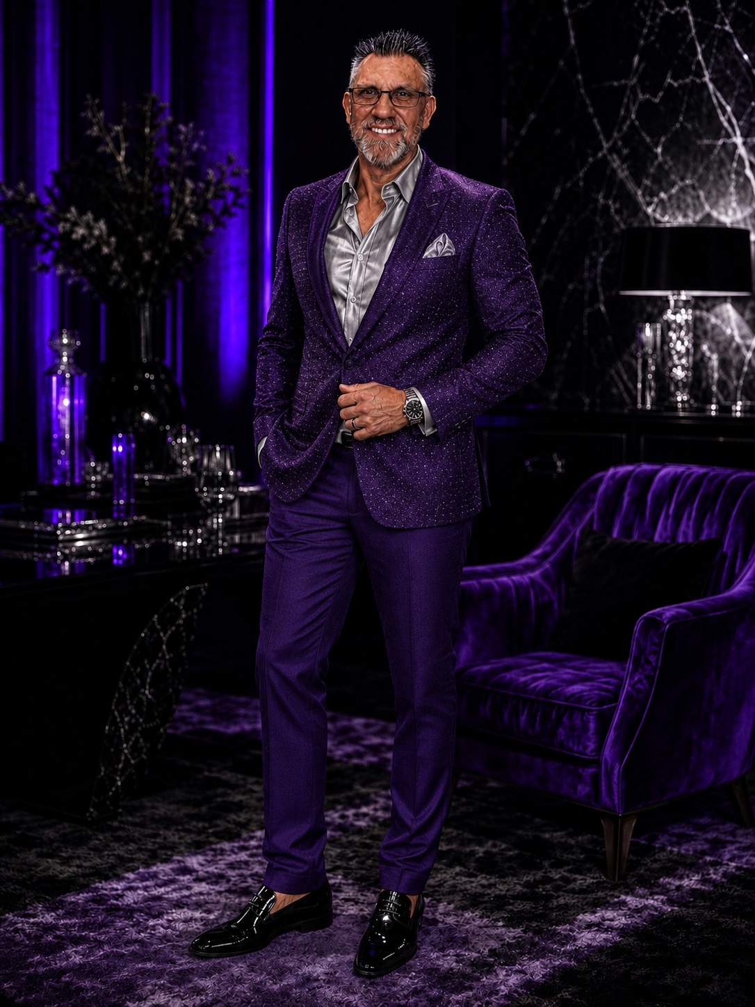 Chuck Dumas in a purple suit representing leadership, vision, excellence, and the Mission Rhyno movement.