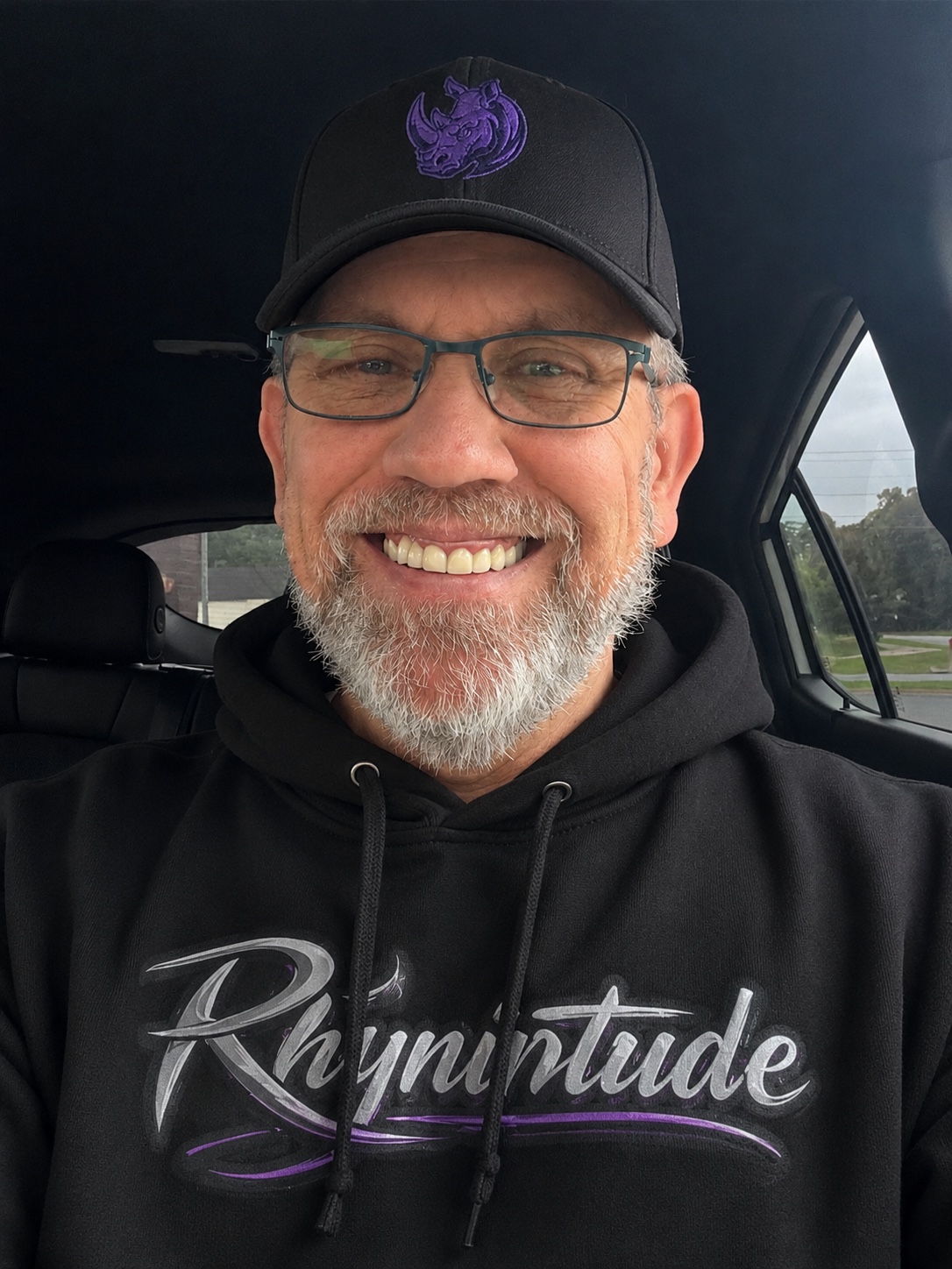 Chuck Dumas wearing a Rhynotude hoodie representing authentic everyday living.
